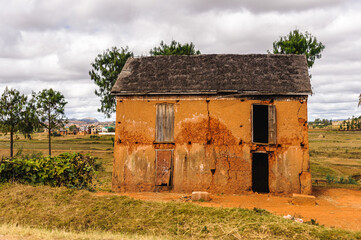 It's Small orange house in Madagascar, Africa