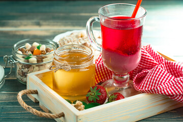 Sweet strawberry and healthy, wholesome food in composition on the table.
