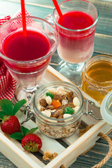 Fruit cocktail from fresh strawberries on the kitchen table.