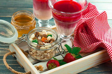 Fruit cocktail from fresh strawberries on the kitchen table.