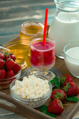 Sweet strawberry and healthy, wholesome food in composition on the table.