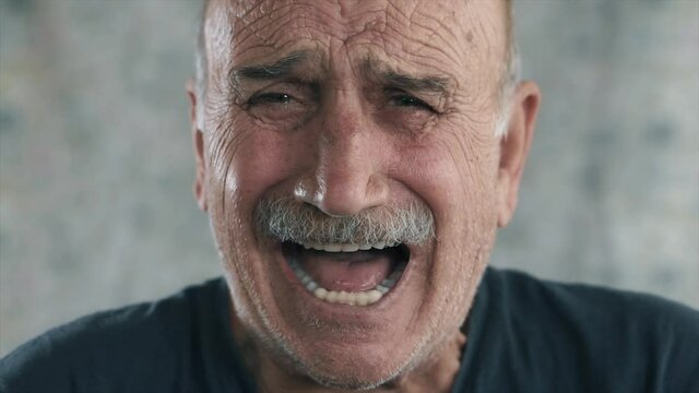An old man screaming, depressed elderly face. Crying and in sad aged person concept.