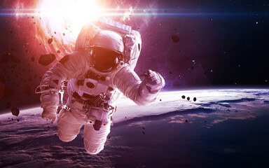 Fototapeta na wymiar Astronaut near the Earth