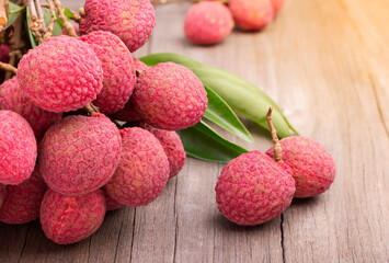 Fresh lychee from the garden Planted in an organic style that is delicious and placed on a wooden table.