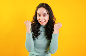 Woman raised up hands to celebrate, success, champion, achievement, happiness and congratulation concept.