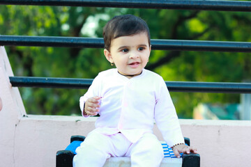 cute indian baby boy playing at home