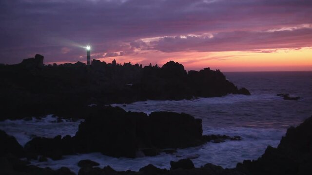 Beautiful sunset on coastline with the Cr&eacute;ach lighthouse, the most powerful in the world , Ouessant island, Brittany, France