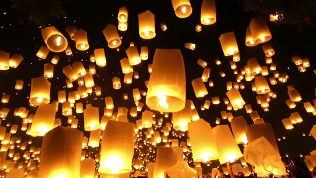 Thousands of flying lanterns launching for Yi Peeng and Loy krathong buddhist festivals in Mae Jo university, near Chiang Mai, Thailand.