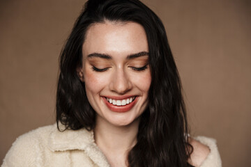 Photo closeup of funny cute woman laughing and looking downward