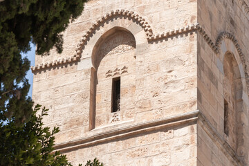 Arabic text carved in stone above the window of a Minaret of the Omar Mosque in the old city of Jerusalem, Israel