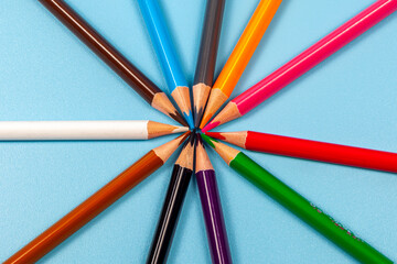 Fototapeta premium colored pencils isolated on blue background