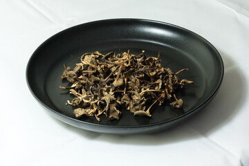 Dried chanterelles  on a plate to be used in sauces and stews