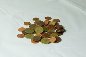 coins on a table with white background
