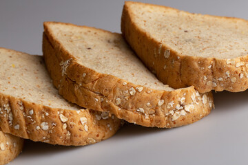 Whole wheat bread isolated on white background. Slice bread, made from 12 kinds of grains, clearly portray the texture and look delicious.