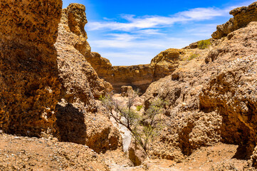 It's Sesriem Canyon, a natural canyon carved by the Tsauchab rivier in the sedimentary rock, Namibia