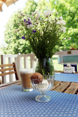 Coffee and ice cream on a table in a coffee shop. Moscow, June, 2020.