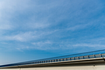 Obraz premium low angle view of bridge against sky with clouds
