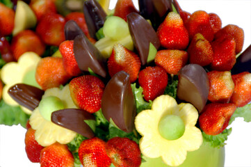 Assorted colorful fruits arranged into a decorative bouquet