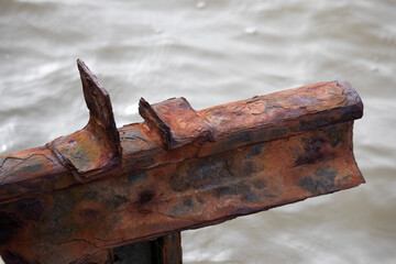 A rusty construction beam by the sea