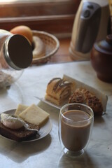 breakfast with poached egg coffee and cake