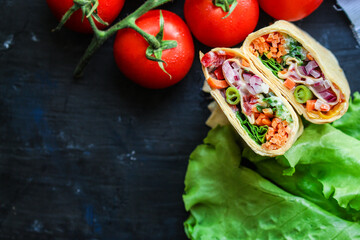 wrap tortilla or burrito stuffing vegetables vegetarian pita bread raw fish seafood in ice quick freeze Menu concept serving size. food background top view copy space for text organic healthy eating 