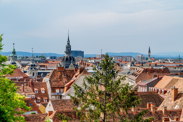 Naklejka premium Beautiful panoramic view of Graz, Austria with churches, traditional Austrian houses and buildings from Schlossberg (Castle Hill)