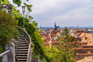 Stone stairs leading up the Schlossberg (Castle Hill) observatory in Graz, Austria with panoramic...