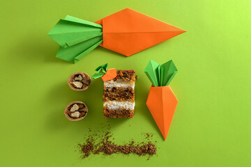 slice of carrot cake with nuts and paper carrots
