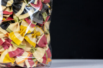 packet of farfalle pasta bows in unusual colours 