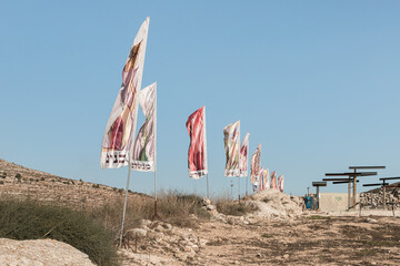 Flags with the names of all the tribes of Israe lon the archaeological excavations of the Ancient Shiloh archaeological site in Samaria region in Benjamin district, Israel - obrazy, fototapety, plakaty