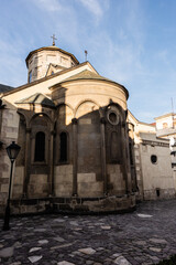 Fototapeta na wymiar ancient armenian cathedral against blue sky in lviv, ukraine
