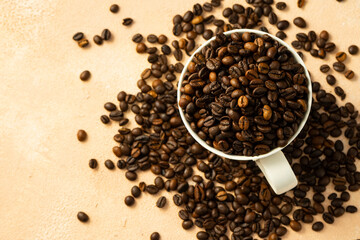  roasted coffee beans in a white ceramic mug