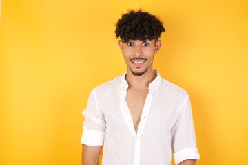 Young handsome man having broad white smile being excited to meet Friends and go out to have a good day.