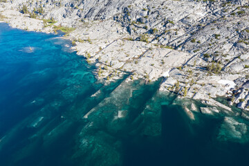 Snowmelt has filled a high mountain lake in the Sierra Nevada mountains in California. These scenic mountains, that rise between 5,000 and 9,000 feet, provide amazing wilderness areas for hikers.