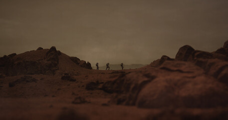 Three astronauts walking on a surface of a red rocky planet. Mars colonization concept. Planet created in 3D