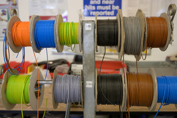 Electrical wire on spool close up in factory