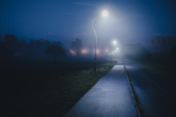 misty alley in the Park with lanterns