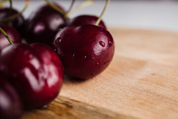 Close-up of a cherry tree on a wooden Board. Fresh berries
