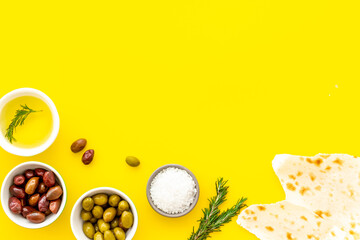 Italian olives, oil, bread - appetizer and snacks - top view copy space