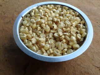 Local organic maize inside the beautiful steel bowl
