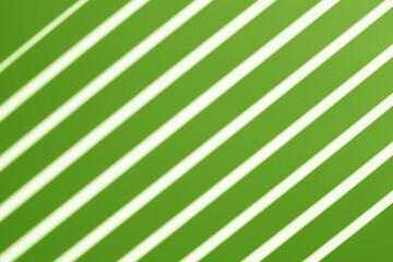green background with diagonal white stripes
