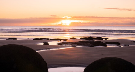 Early winter sunrise at Moeraki Boulder, New Zealand.