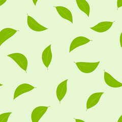 Vector seamless pattern of green leaves on a light green background.