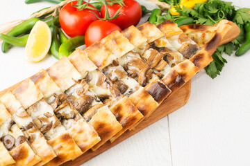 roasting meat and cheese pita