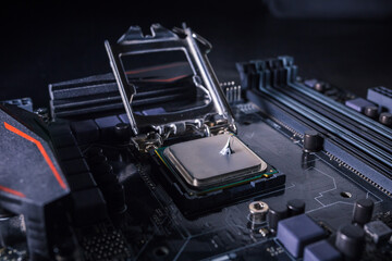 Thermal grease paste on computer processor chip. Thermal compound on on PC CPU. Cooling upgrade concept.