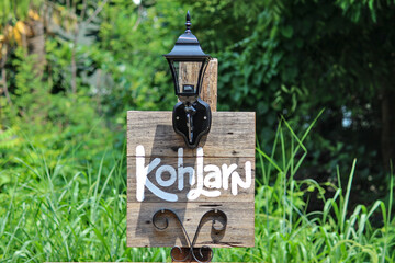 The signpost of Ko Lan, Chonburi. The floor is made of white painted wood. With lamps and patterns...