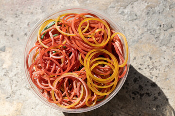 Rubber band in clear plastic cups Used for tie food bags