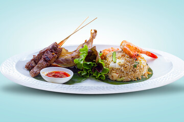 Fried rice with crispy fried shrimp, fried chicken and satay.