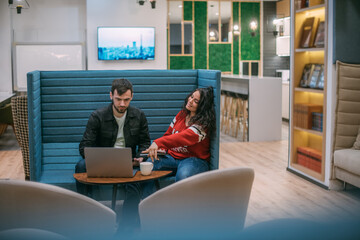 Man and woman work in coworking.