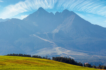 countryside summer landscape. rural fields rolling in to the distant high tatra mountain ridge in...